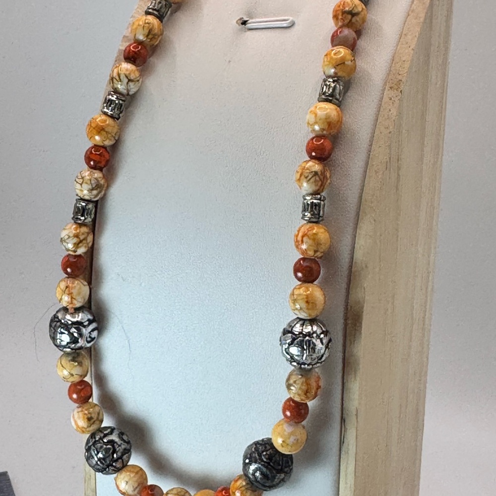 Bohemian Orange and Silver Necklace with Intricate Patterns